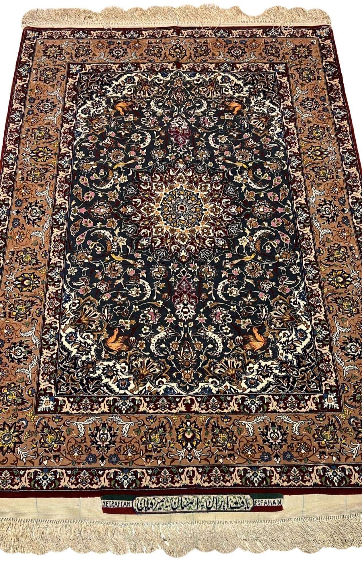 "Hand-knotted Hassan Seirafian Persian rug with silk and wool blend, featuring intricate floral and medallion design."